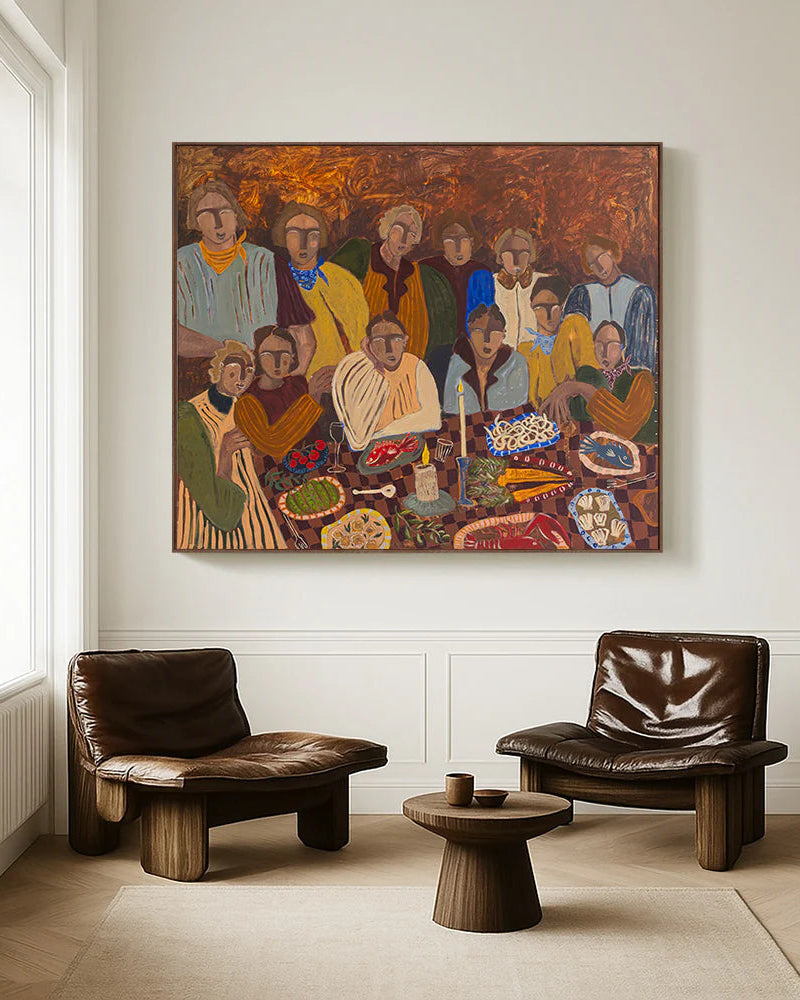 Living room with two brown leather chairs, and a large colorful canvas painting on the wall of a group of people sharing supper.