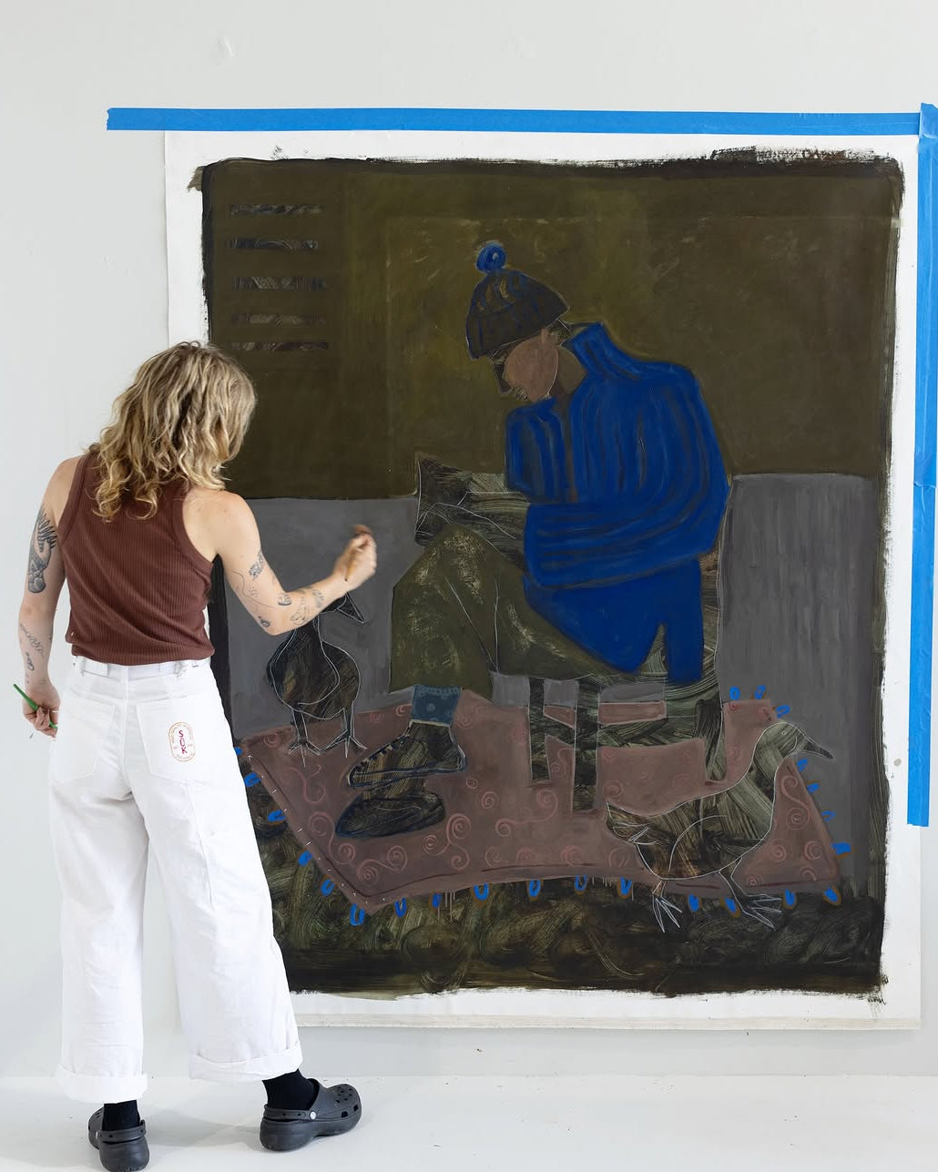 Abstract artwork style original painting of a person sitting on a chair reading a book with a bird with blue, green earthy tones. 